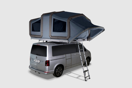 Blue GT SKY LOFT rooftop tent fully inflated and set up on top of a van