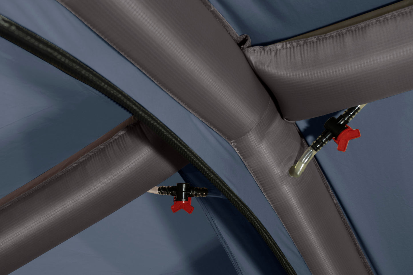 Close up view of the interior air valves attached to the inflatable tent frame