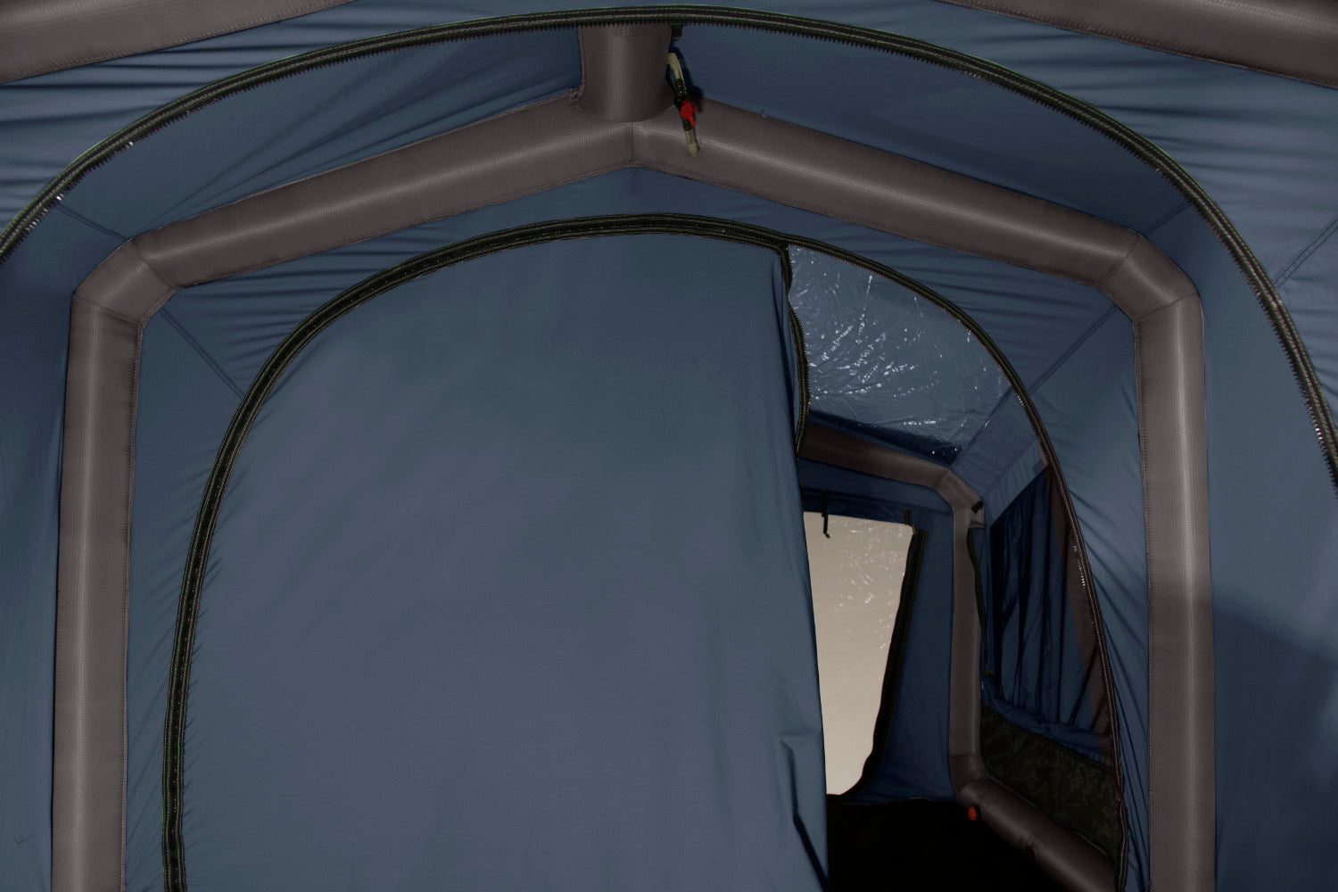 The interior wall is half zipped shut showing how the tent can turn into 2 separate rooms.